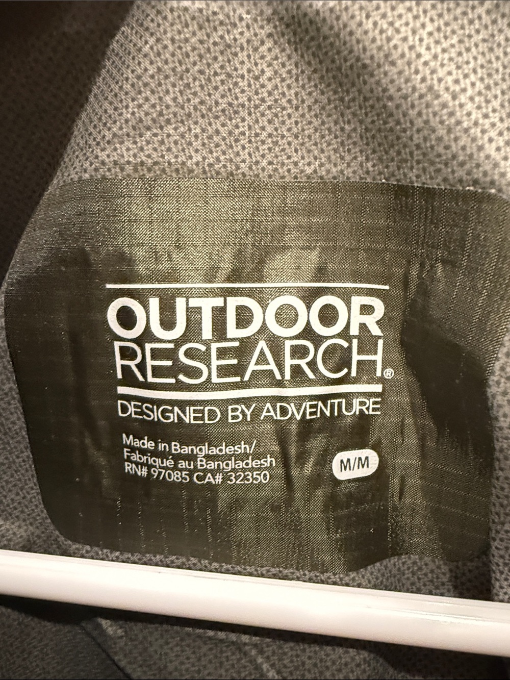 Outdoor Research Helium II jacket in green with orange zipper details. - Picture 3 of 7